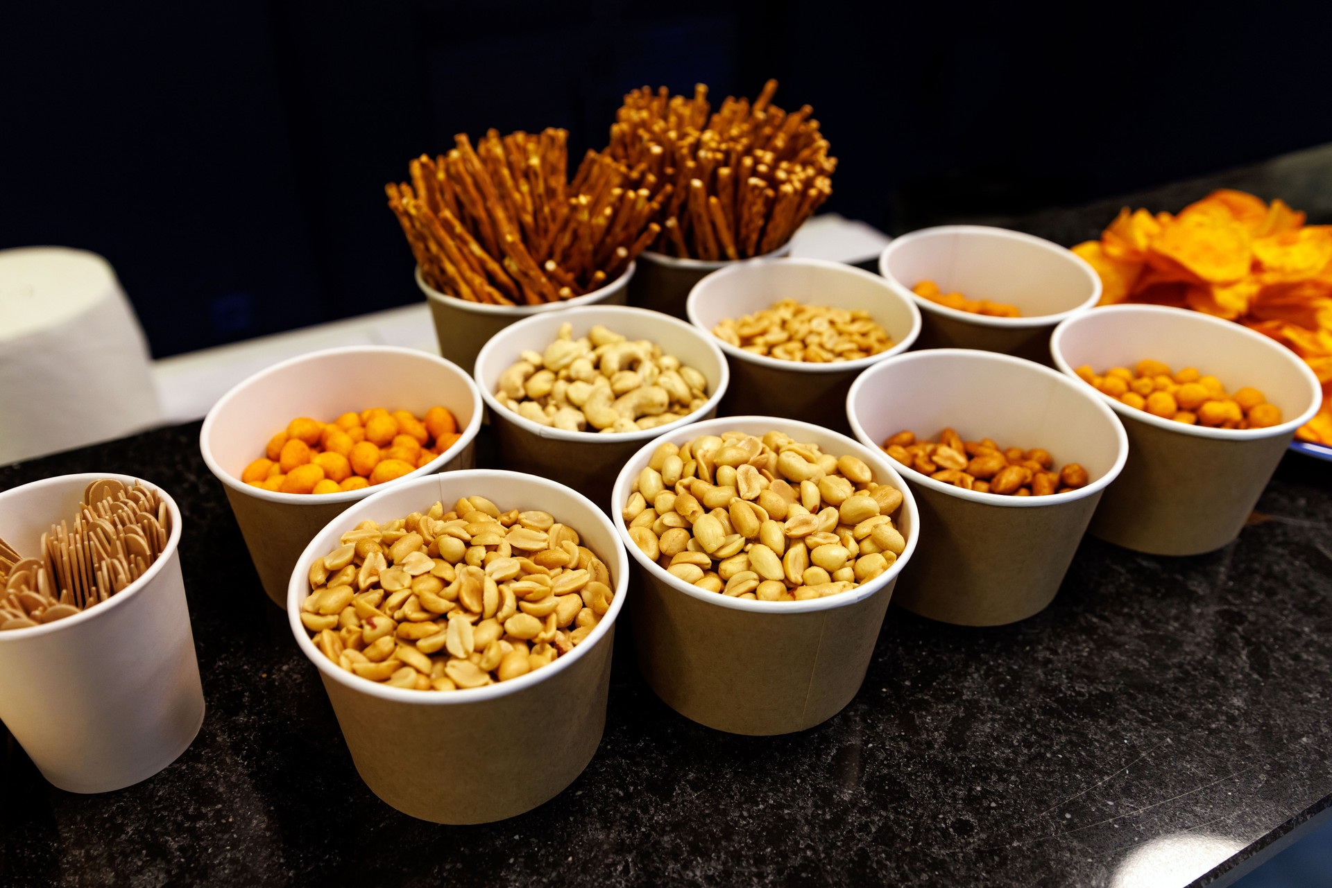 Bowls with different types of nuts for snack.