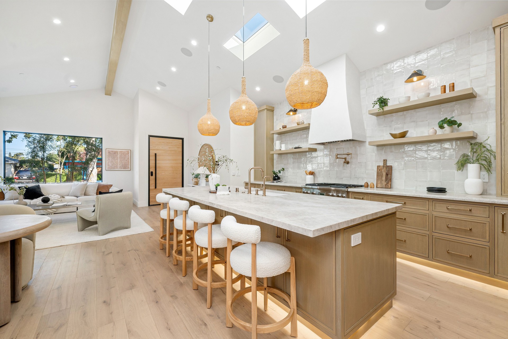 Modern kitchen interior with wooden cabinets and island.